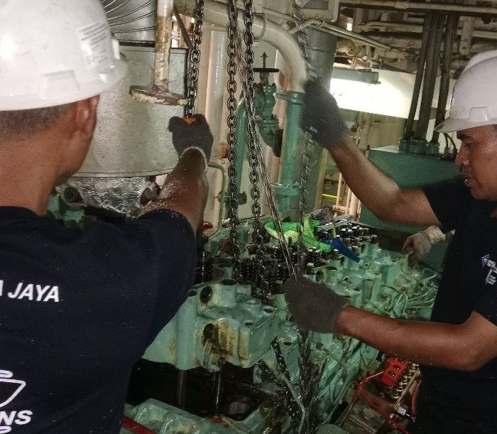 UMJ engineers carrying out maintenance in an engine room